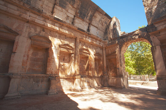 Hidden gems of France concept. Interior of The Temple of Diana. Ancient Roman cult building in Nimes, territory of Jardins de la Fontaine. Outdoor shot. Sunny weather.