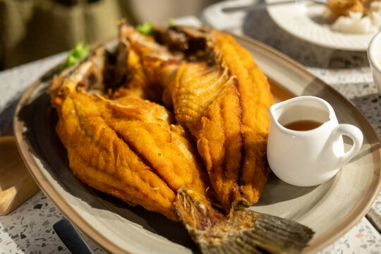 Deep fried Sea bass with Fish Sauce served on plate. Thai food