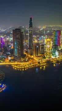 Aerial view of Ho chi minh city or Saigon city at night in Vietnam. Vertical.