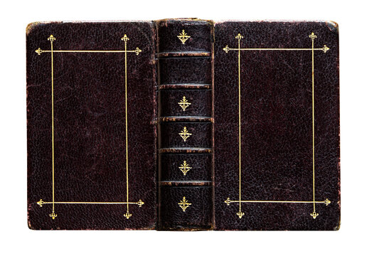 Antique black leather Bible with richly embossed cover and elegant gold detailing, isolated on a white background. 