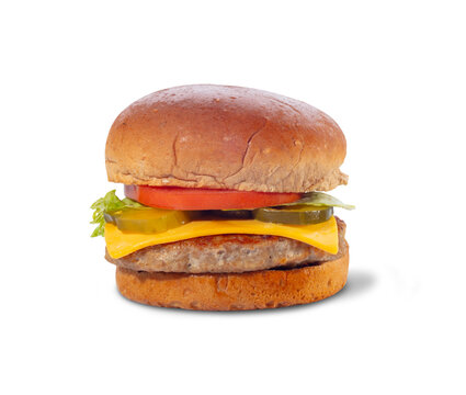 Classic cheeseburger with lettuce, tomato and pickles isolated on white background