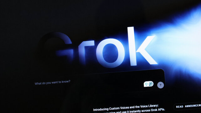Grok ai chatbot logo and interface on screen with blue light effect, xai artificial intelligence platform concept