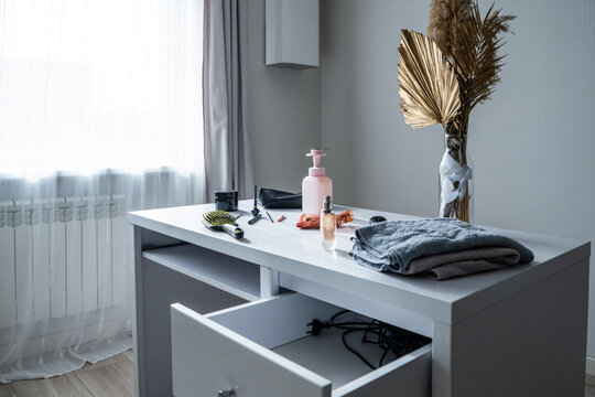 Dressing table with cosmetics and accessories in a bright room