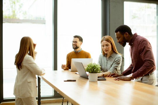 Team meeting in a modern office with focus on collaboration and discussion