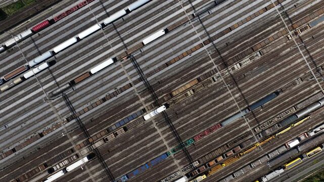 Aerial view of cargo trains moving in a large railway marshalling yard