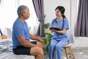 Obraz premium Senior patient nurse home care medical consultation healthcare stethoscope caregiver bedroom talking clipboard, friendly nurse blue scrubs holding clipboard during home care medical consultation