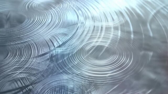 Slow motion pan of concentric ripple circles on glass surface with shimmering light reflections in studio close up