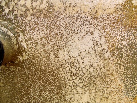 Texture of destroyed APC armor with shell hits and shrapnel holes, damaged armored vehicle hull from modern military conflict, rusty steel surface of knocked out armored personnel carrier, war destruc