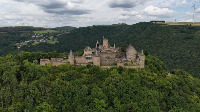 Aerial view of bourscheid castle on a forested hill in luxembourg