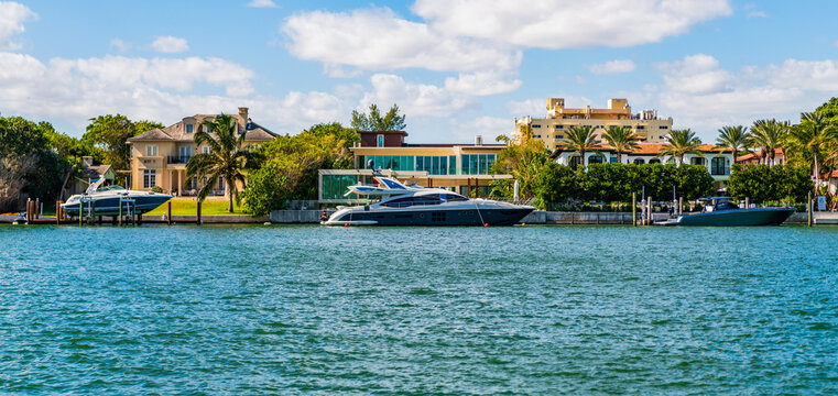 Residential apartment in waterfront city. Waterfront landscape with house. Vacation building in summer. Luxury waterfront house. Hotel building. Residential architecture. Modern building Florida
