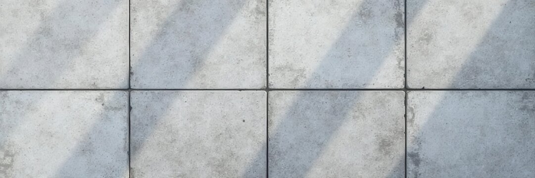 An overhead view of grey square terrace tiles with a concrete effect and non-slip surface, perfect for home decor and texture background , non-slip, home