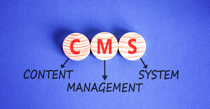 CMS content management system symbol. Concept words CMS content management system on beautiful wooden circles. Beautiful blue background. Business CMS content management system concept. Copy space.