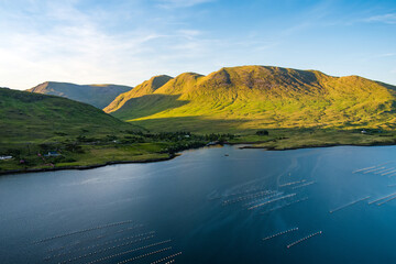 Obraz premium Aerial view of Killary Fjord near Leenane on the Galway Mayo border, Ireland. Irelands only fjord winds through the dramatic Connemara and Mayo mountain landscape.