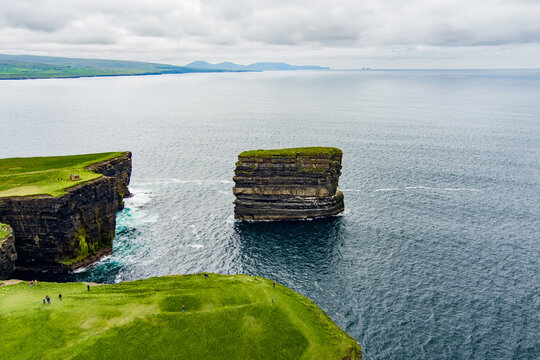Aerial view of Dun Briste sea stack at Downpatrick Head, County Mayo, Ireland. Spectacular layered cliffs and Atlantic waves on the Wild Atlantic Way.