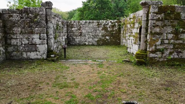 Drone flying up from ancient Santa Marina de Augas Santas monument ruins