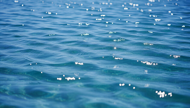 Image of a blue water surface with a pattern of small%2C sparkling waves.
