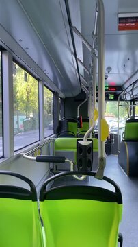 Inside Public Transport: An interior shot of a public bus, featuring sleek design and organized seating arrangements. Milan, Italy