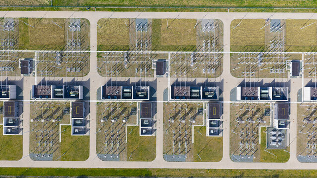 Aerial view of an electrical substation with symmetrical rows of power transformers and high-voltage equipment in Velsen-Noord, North Holland, Netherlands.