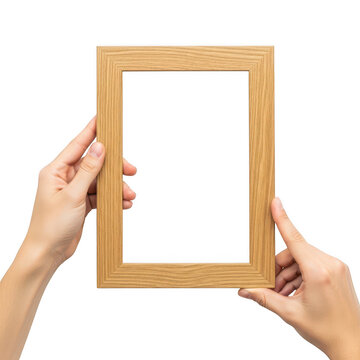 Hands holding a wooden picture frame against white background