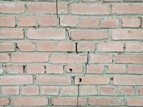 Cracked red brick wall texture background