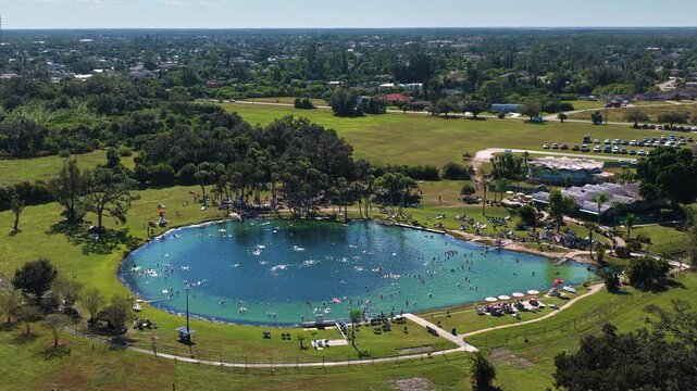 Famous Florida Warm Mineral Spring with clear geothermal water, surrounded by greenery, offering therapeutic bathing, outdoor leisure and scenic relaxation.