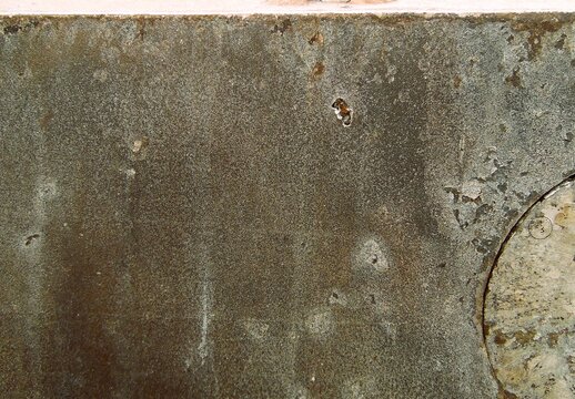 Texture of destroyed APC armor with shell hits and shrapnel holes, damaged armored vehicle hull from modern military conflict, rusty steel surface of knocked out armored personnel carrier, war destruc