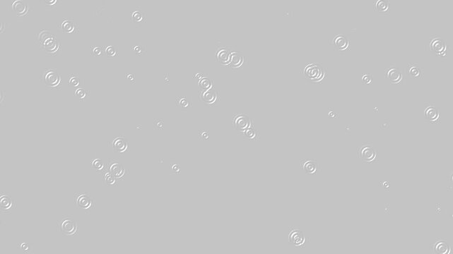 Rain Drops Falling into Blue Water Puddles and Lake Surface in Seamless 4K Loop Animation. Rain drops fall on water surface of pond, lake or river forming a uniform background.