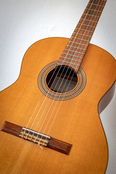 Close up of classical Spanish guitar with wooden body and strings