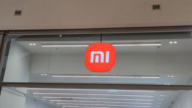 Vilnius Lithuania 09.05.2026 Xiaomi Mi technology store illuminated logo in modern shopping mall consumer electronics and smart device retail showroom with minimalist commercial design