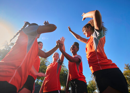 Female Soccer Athletes Celebrating Teamwork and Fitness