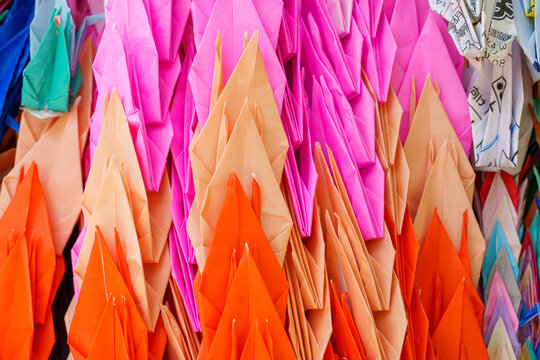 Colorful origami paper cranes with rainbow of colors in the streets of Hiroshima Japan