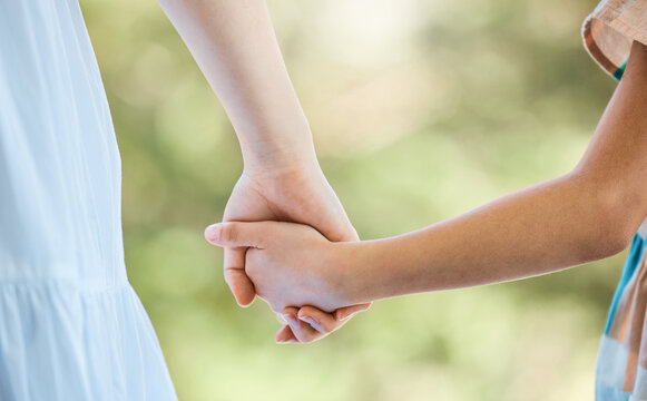 Love, parent and child outdoor with holding hands, bonding together or support in childcare. Bokeh, woman or kid with trust, healthy relationship or family connection for childhood development.
