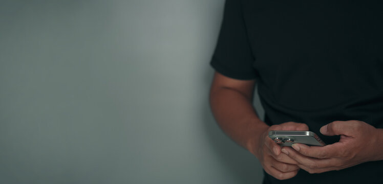 Man holding smartphone and using mobile application for online payment and financial management. Cyber security, fintech innovation, digital banking and secure transaction concept for technology backg
