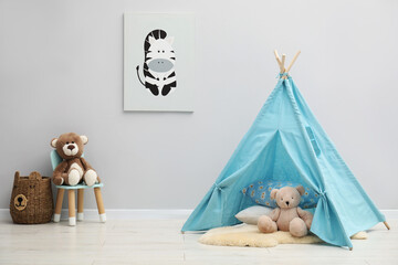 Wigwam, toys, small chair, basket and picture in child's room © New Africa