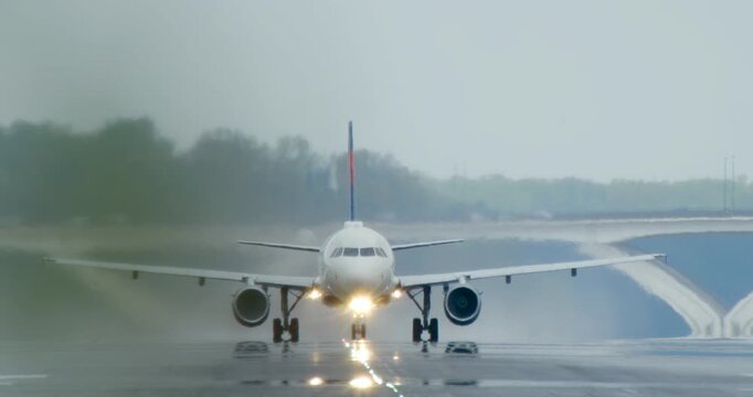 Commercial Jet Taking Off in the Rain from DCA Airport in Washington DC