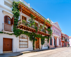 Fototapeta premium Colombia, Cartagena, a street in the historic center with colorful houses