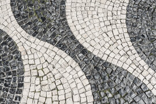 Wavy pattern in pavement, black and white, cobblestones, Rossio, Lisbon, Portugal