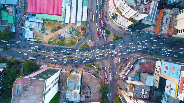 Aerial drone top video of Gulshan 1 circle Dhaka city traffic busy cityscape streets.