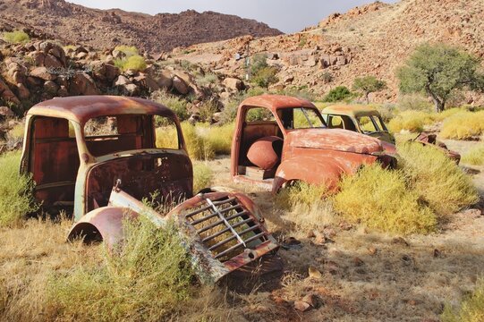 Scrap vehicles near the Namtib Lodge in the Tiras mountains, Namibia, Africa