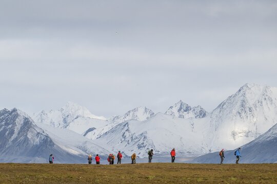 Group of tourists, snowy mountains, Down Islands, Dun&oslash;yane archipelago, Svalbard, Norway
