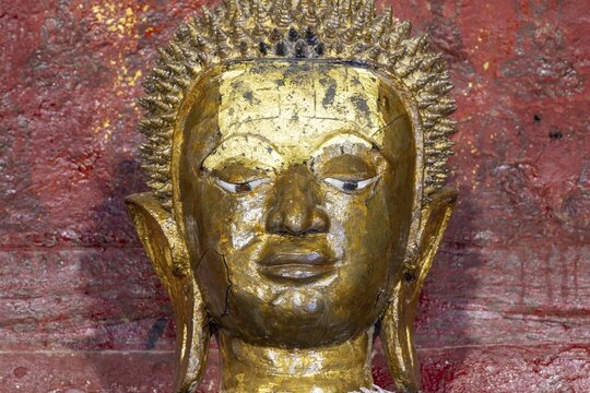 Golden Buddha statue, Bhumispara-mudra, Buddha Gautama at the moment of enlightenment, Wat Long Koon, Luang Prabang, Laos