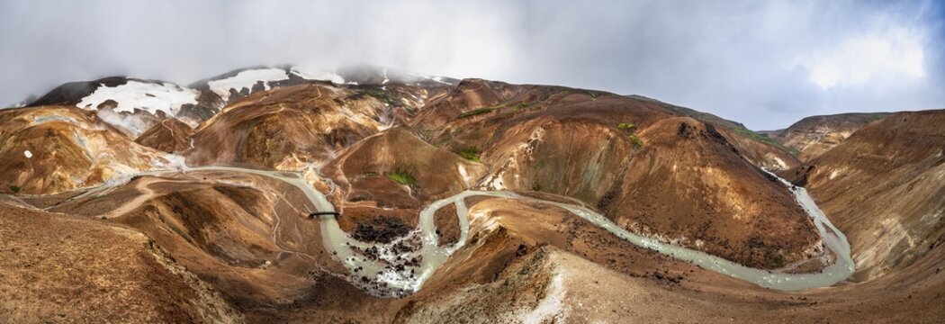 Red coloured rocks, river flowing through Kerlingarfjoll geothermal field, Su&eth;urland, Iceland
