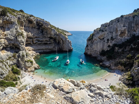 Stiniva Bay on Vis island in Croatia with crystal clear turquoise water as a travel destination alternative to Hvar