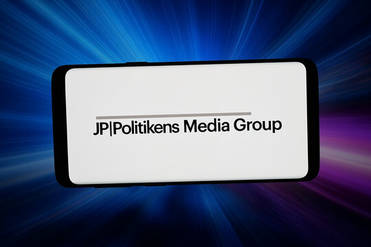 Stuttgart, Germany - 05-06-2026: In this photo illustration, the logo of media company JP Politikens Hus AS (JPPOL) is displayed on a smartphone in front of abstract background on computer screen.