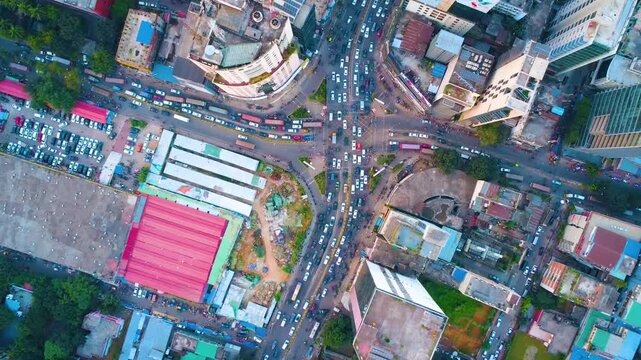 Aerial drone top video of Gulshan 1 circle Dhaka city traffic busy cityscape streets.