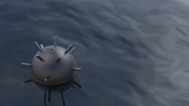 Moored naval mine floating in wavy water