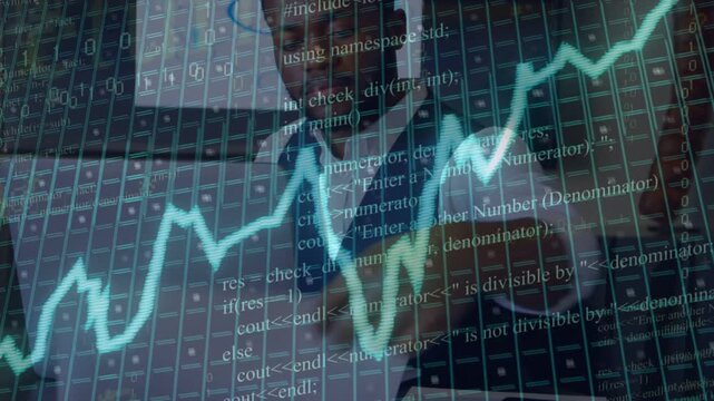 Male financial analyst leaning forward typing, responding to teal INFLATION chart and code overlays