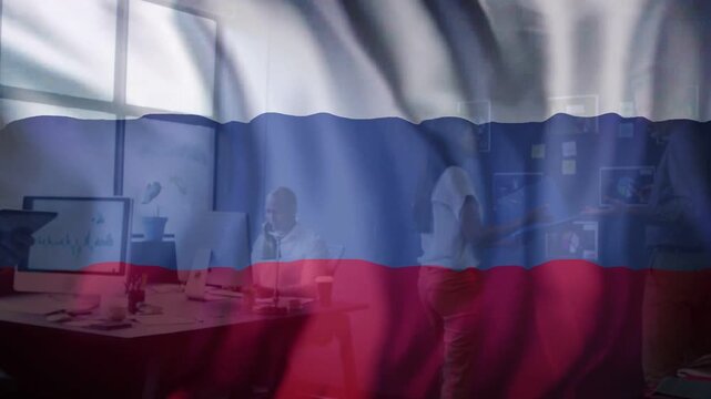 Animated flag overlay waving across camera, revealing office team collaborating at desk