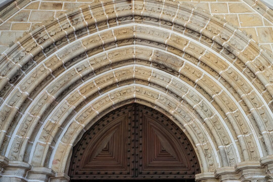 Layered stone arch detail on a historic church doorway
