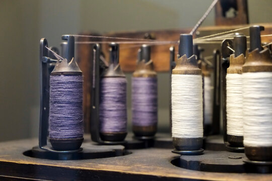Antique thread spools in a textile workshop